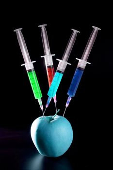 Bio genetics research of food , apple manipulation with syringe