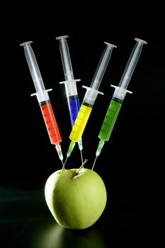 Bio genetics research of food , apple manipulation with syringe