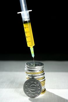 Euro currency syringe injection. Bank crisis financial credit metaphor.