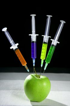 Bio genetics research of food , apple manipulation with syringe