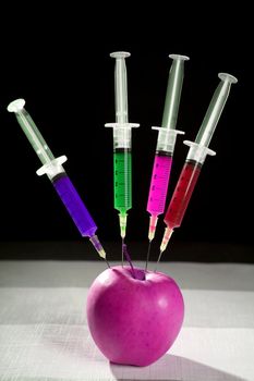 Bio genetics research of food , apple manipulation with syringe