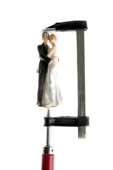 Wedding figurine under pressure, like premonition metaphor