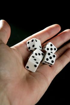 Gambler five dices, luck metaphor over black background