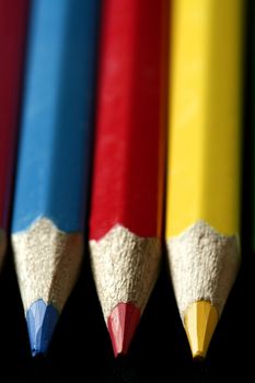 Colorful set three pen in vibrant colors over black background