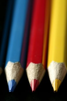 Colorful set three pen in vibrant colors over black background