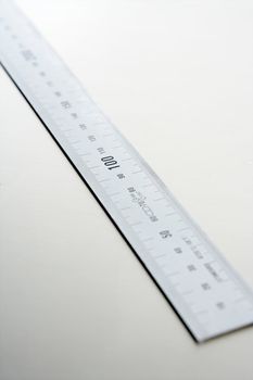 Silver aluminium metal, ruler meter on stainless steel studio backg