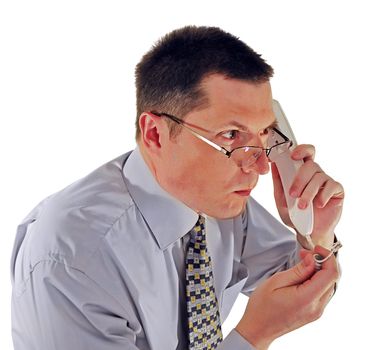 portrait of man in glasses with a telephone