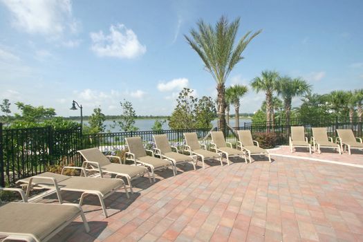 A Deck with Chairs overlooking a Lake