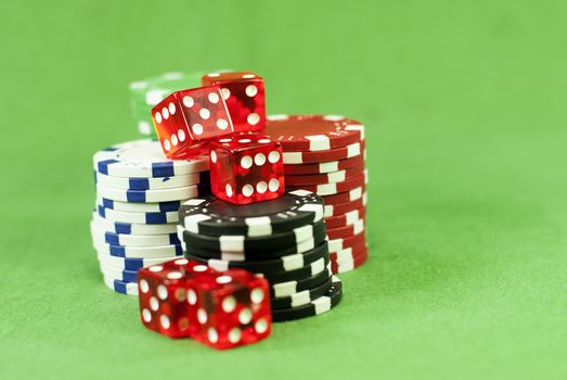 poker chips on green carpet