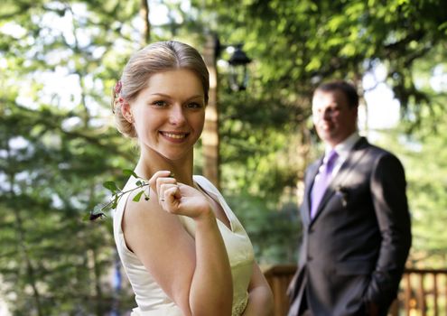 Newly-married couple in park