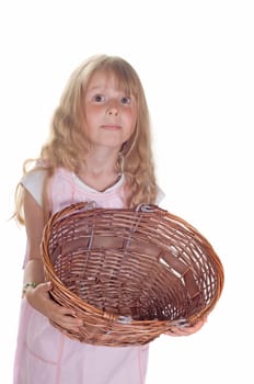 Shot of little girl playing with basket in studio