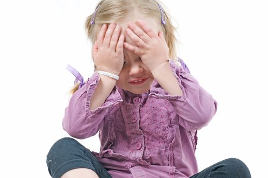 A little girl sitting