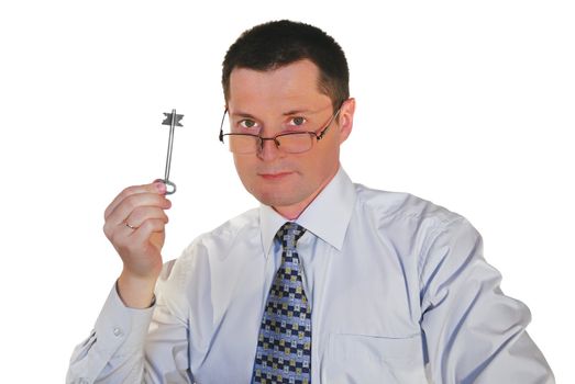 portrait of man in glasses with a toy key