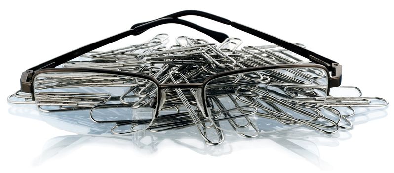 Clips and glasses on a piece of paper. Business scene