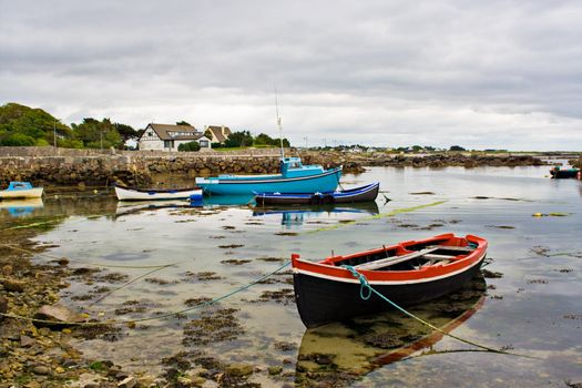 Several boats tied up on the edge of Galway Bay, Ireland.