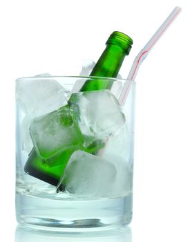 Cocktail: glass with ice and green bottle