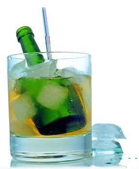 Cocktail: glass with ice and green bottle