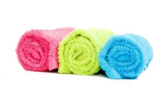 Colorful towel rolls on a white background