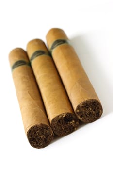 three cigars on white background
