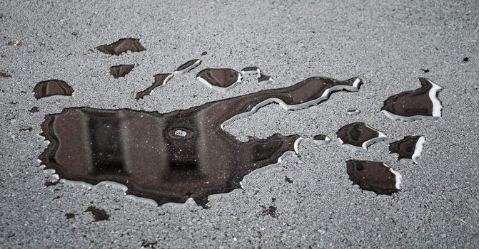 drops of rain water on a fresh asphalt