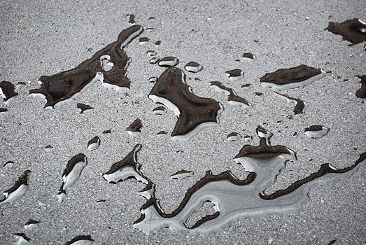 drops of rain water on a fresh asphalt