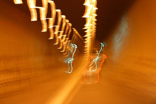 blur of lights while driving in tunnel