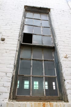 old window on worn brick wall