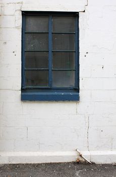 old window on worn brick wall