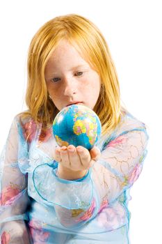 schoolgirl is looking at the world laying in her hand on white