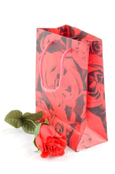 giftbag with red rose isolated on white background