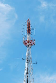 photo of a communication tower against blue sky background