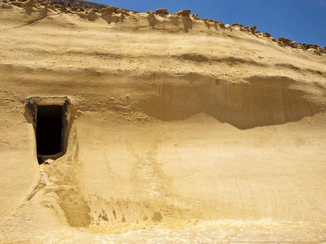 Cave dwelling carved into soft sandstone or limestone in Qbajjar in Gozo