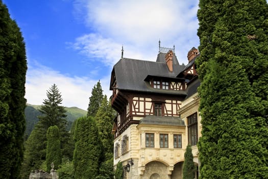 old castle in the forest and blue sky