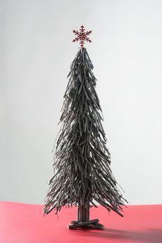 Original wood sticks christmas tree, simple at studio background