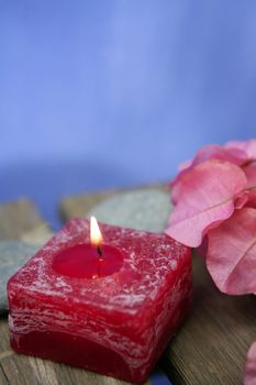 Natural theraphy, stones, and candles over wood