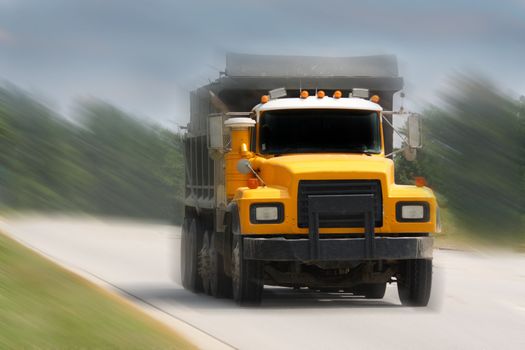 dump truck driving on road