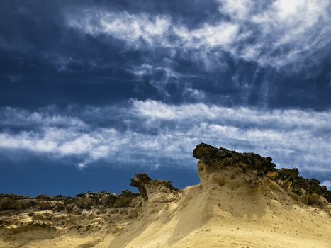 Beautiful and unique eroded sandstone cliff faces at Qbajjar in Gozo