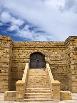 Medieval castle or fortress with highly eroded walls in the island of Gozo