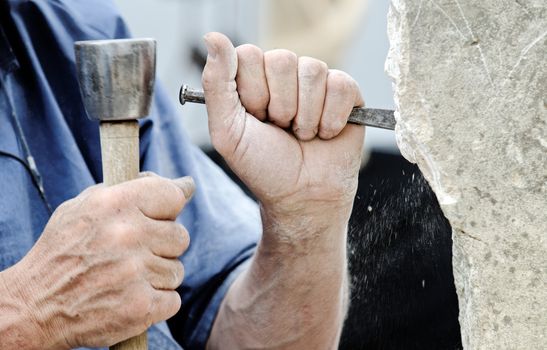 a stone carver at work