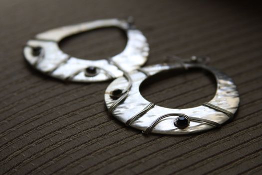 Close up of the silver earings.