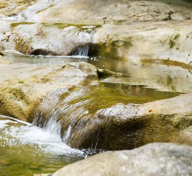 Mountain small river.A fragment of the mountain river running among stones