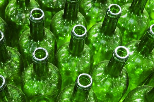 Stack of empty green glass bottles