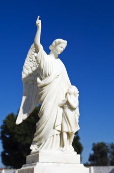White angel sculpture in a catholic cemetery, Portugal