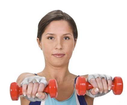 Portrait of a young woman doing barbells exercises.