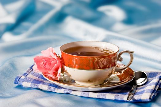 cup of tea with flower over azure