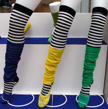 colorful pants on mannequin legs          