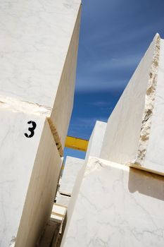 Marble blocks aligned in factory yard, Alentejo, Portugal