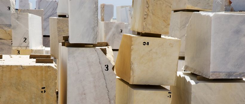 Marble blocks aligned in factory yard, Alentejo, Portugal