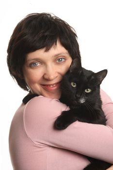 TThe girl embraces a black cat