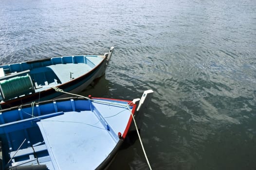 Couple of small fishing rowboats moored